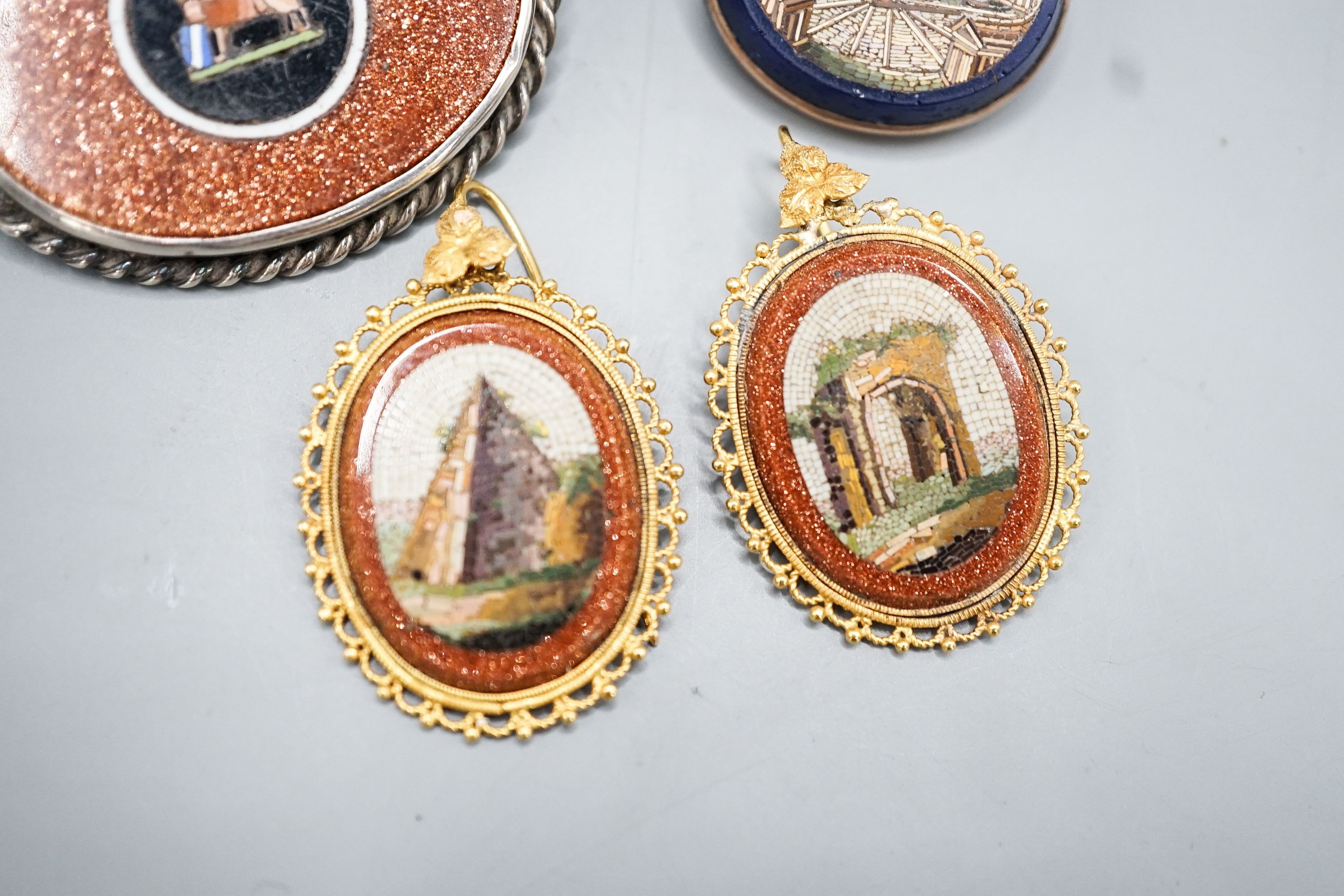 A pair of yellow metal mounted adventurine glass and micro mosaic oval earrings, decorated with ancient architecture, 32mm, a small micro mosaic oval brooch and a white metal mounted adventurine glass and micro mosaic ov